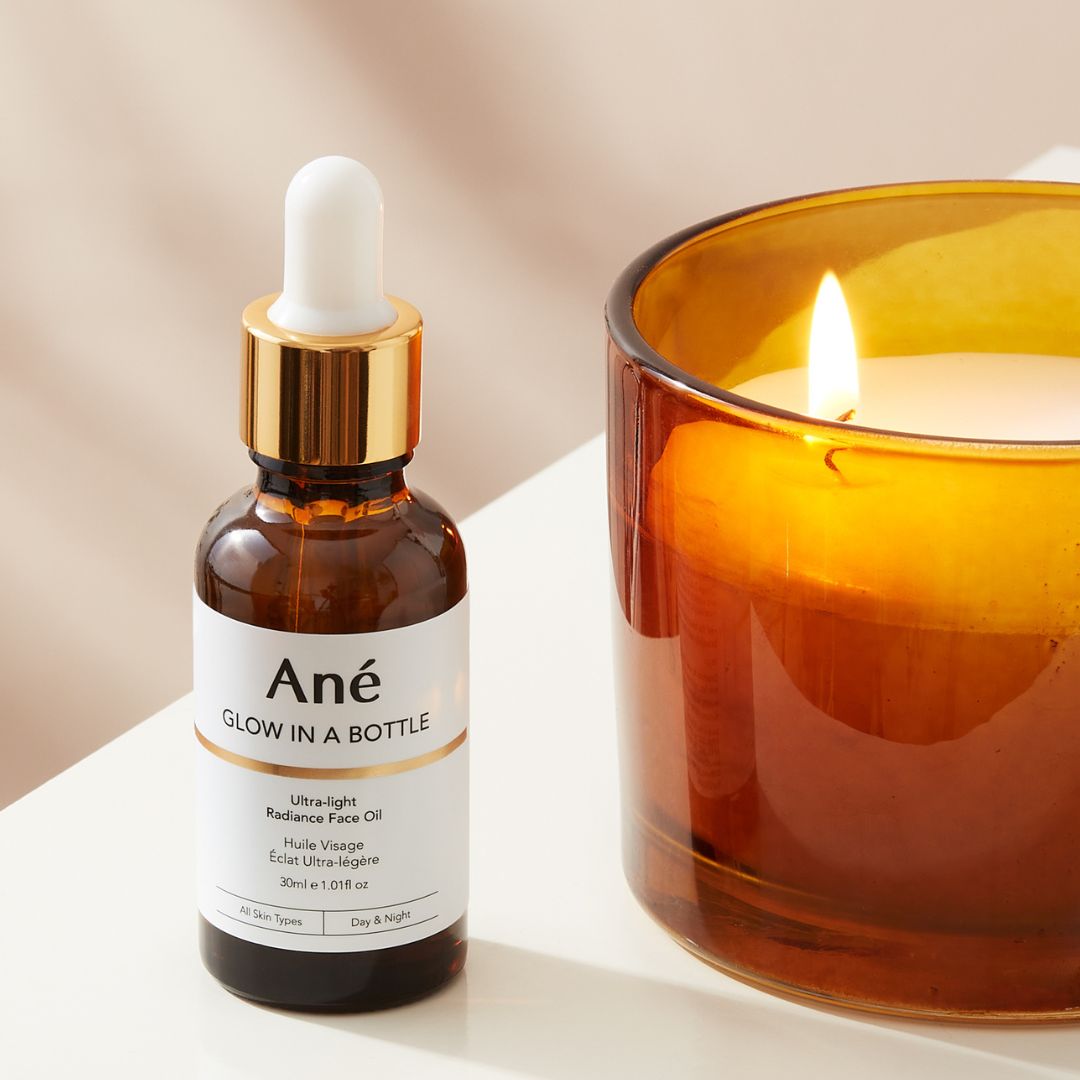 Ané Glow in a Bottle face oil with candle