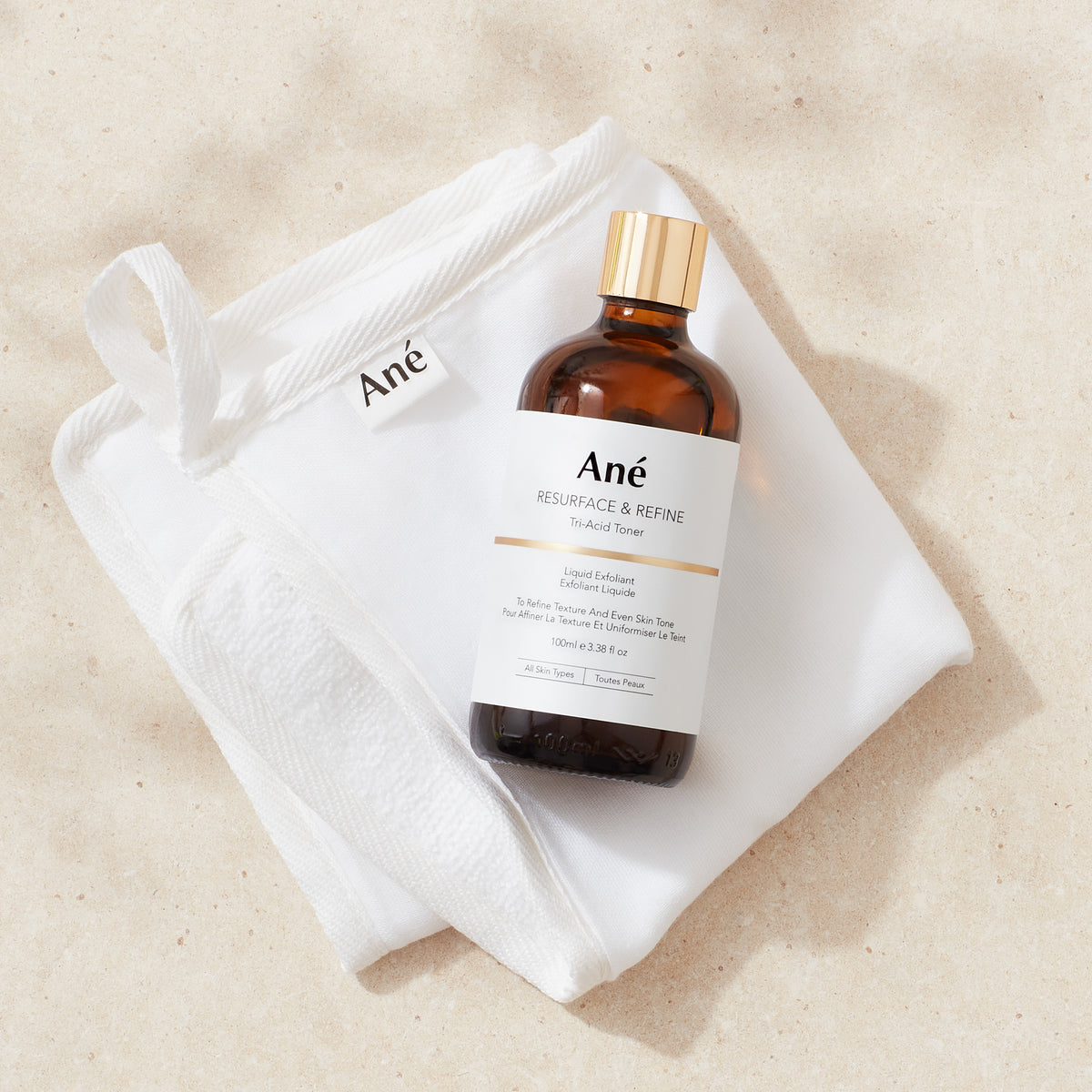 Ané muslin cloth with Resurface &amp; Refine toner bottle